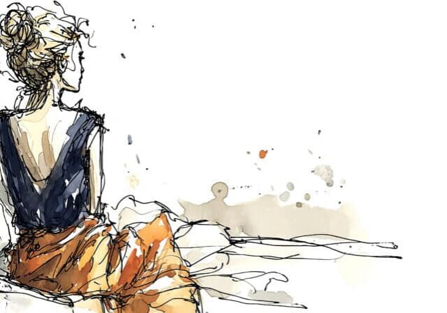 Vrouw zit alleen op bed